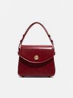 Bolso para mujer de mano con solapa y acabado elegante